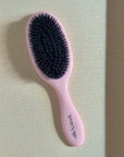 Pink hairbrush with mixed boar and nylon bristles gentle brushing of hair extensions  - Slik & Sleek London hair health specialist